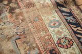 Worn texture and muted blue, coral, brown patterns on this antique Turkish Demirci rug.