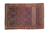 Antique Malayer rug, dark blue field with herati motif, red tones, and prominent striated abrash.