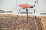Antique Persian Kurdish rug corner, showcasing rainbow boteh pattern and time-worn borders.