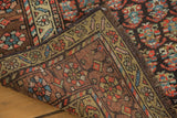Antique hand-knotted Kurdish rug corner, with olive green border and dark brown field.