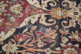 Detailed view of historic reweaves and low pile texture on an antique Persian Lavar Kerman carpet.