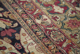 Intricate floral details and time-softened colors in the paneled design of a late 19th-century Kerman carpet.
