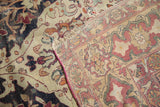 Revealing the hand-knotted foundation and secured selvedge of an antique Kerman carpet.