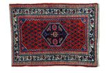 Vintage Persian Engelas rug mat, red rust field, deep indigo medallion, herati leaves.