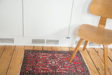 Vintage Lilihan rug mat, full pile cherry red floral bouquet with medallion design.