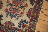 Vintage Kerman rug border with rococo planters and blossoming red, blue, blush florals.