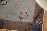 Art Deco Chinese mat detail: grey field, bronze border, pink floral, blue tendrils, localized wear.