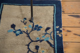 Hand-knotted Antique Chinese Peking rug with blue floral arrangements on beige, cobalt indigo border.