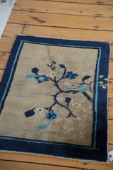 Secured edge of antique Peking rug, dark cobalt indigo border, and subtle color migration.