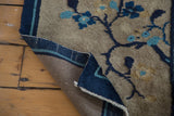 Hand-knotted foundation and secured dark cobalt indigo border of an antique Peking rug.