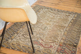 Geometric Perpedil motifs and rhythmic patterned border of a distressed antique Caucasian rug.
