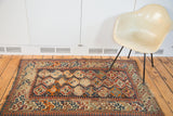Distressed antique Caucasian rug, lower section with geometric border and exposed foundation.
