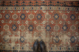Antique Caucasian rug with naturally distressed brick red field and Lotto inspired border.