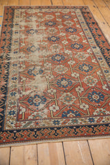 Naturally worn brick red field, repeating blue floral motifs, and Lotto inspired border.