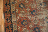 Detail of distressed brick red field with splayed floral motifs and Lotto-inspired geometric border.