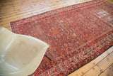 Vibrant red and orange Herati pattern on a distressed vintage Malayer runner.