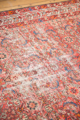 Vintage Malayer runner with distressed pile and faded red, orange, blue Herati pattern.