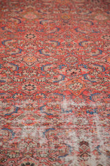 Vivid red and blue Herati design with distressed texture on vintage Malayer runner.