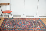 Vintage Dargazine rug with aqua central medallion, brick red field, and intricate floral motifs.