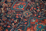 Vintage Dargazine rug's brilliant indigo, brick red, aqua geometric and curvilinear motifs.