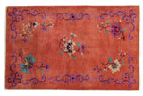Vintage Chinese Art Deco rug with blush peach field, blossoming florals, and deep violet border.
