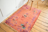 Blush peach field with violet purple scroll border and original side selvage.