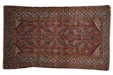 Luminous antique Northwest Persian hand-knotted rug, madder root red field, indigo patterns.