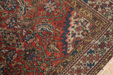 Antique Northwest Persian rug detail: geometric border, madder red, indigo, saffron, with aged patina.