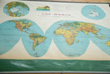 Vintage Rand McNally Merged Relief world map with faded colors and visible green bottom edge.