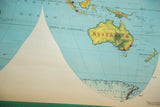 Vintage 1960s world map detail showing Australia, Indonesia, and Antarctica with faded colors.