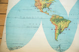 Vintage 1960s world map showing faded North and South America and Pacific Ocean.
