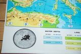 Mid Century Crams Europe Map with globe inset and colorful water depth legend.