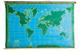 Vintage Nystrom pull-down World chalkboard map with green continents and blue oceans.