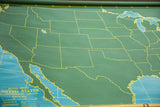 Vintage green chalkboard USA map with yellow state outlines and chalk marks.