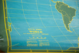Vintage World chalkboard map with dark green South America, blue-green oceans, yellow text.
