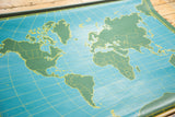Vintage World pull-down map detail: green landmasses, blue oceans, yellow grid lines.