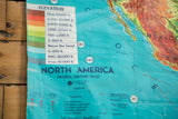 Vintage 1960s North America map legend, showing elevation scale, vibrant blue ocean, and crinkling.