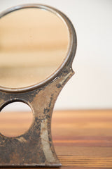 Chippy paint and aged metal texture on the vintage 1930s Hollywood mirror.