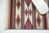 Earthtone Southwest Mouse Pad with geometric patterns in brick, teal, beige, visible fringe, and white mouse.