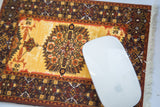 Intricate geometric medallion on saffron gold field of the Persian rug mouse pad.
