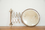 Vintage Fleur De Lis Shaving Mirror, early 20th century, with rusted accordion and cracked glass.