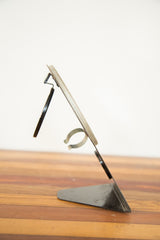 Art Deco Hollywood Mirror side view, featuring its black metal stand and folded mirror.