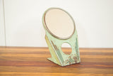Art Deco Hollywood Mirror, mint green metal stand, geometric design, and charming patina, 8 inches tall.