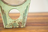 Vintage Hollywood Mirror's mint green stand base with art deco stripes and chipped paint.