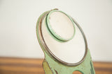 Mint green Art Deco mirror frames showing original chippy paint.