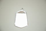 Small art deco bell shaped mirror hanging by wire and screw.