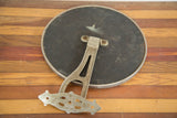 Back view of the antique Victorian barber mirror showing ornate metal hardware and dark backing.