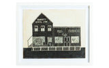 Antique General Store Folk Art carving depicting black and white storefronts in a white frame.