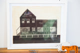 Antique General Store folk art carving showing white etched lines on a dark facade.