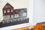 Close-up of vintage folk art carving, Peg's French Cafe with etched details.